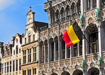 Belgian flag on the Grand Place Broodhuis in Brussels.
