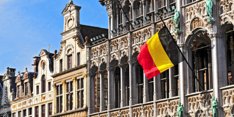 Belgian flag on the Grand Place Broodhuis in Brussels.