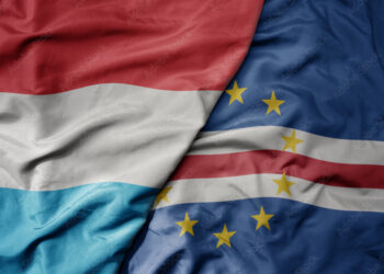 big waving national colorful flag of cape verde and national flag of luxembourg .