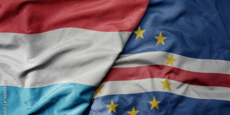 big waving national colorful flag of cape verde and national flag of luxembourg .