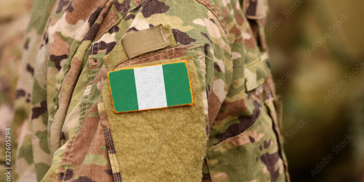Nigeria flag on soldiers arm. Federal Republic of Nigeria troops (collage)