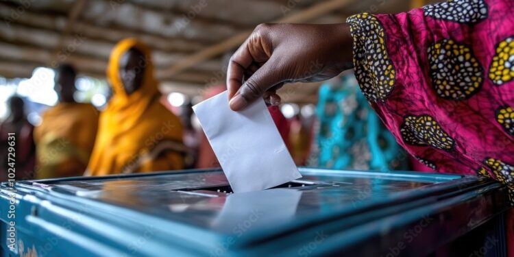 Woman dropping ballot at polling station during election day