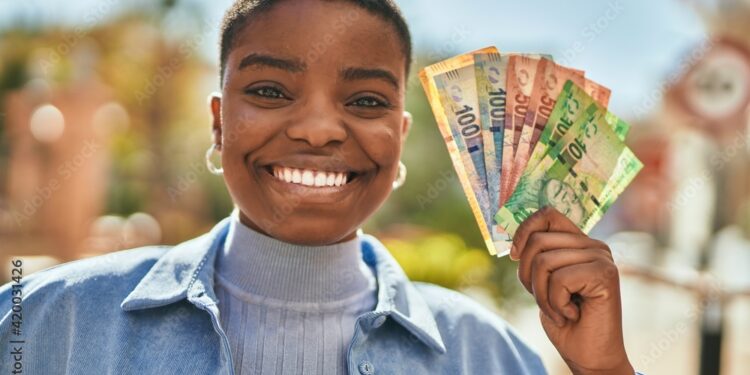 Young african american woman smiling happy holding south africa rand banknotes at the city.